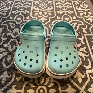 Girls teal crocs size 1